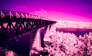 Multispectral Infrared IR and Ultraviolet UV image of Grand Trunk Railway Bridge crossing the South Saskatchewan River. Credit: Danno Peters